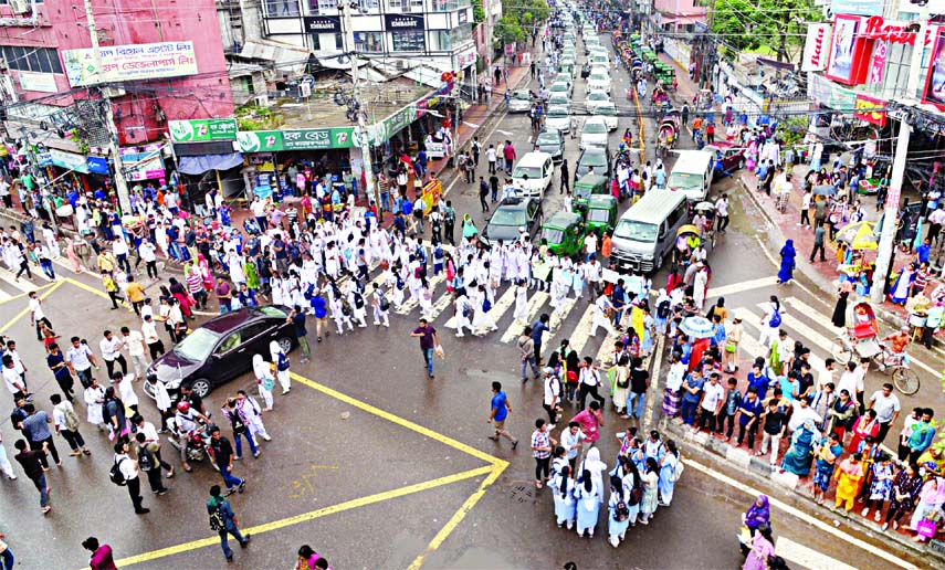 Male and female students blocked Shantinagar intersection demanding safe roads and implementation of their 9-point demands on Saturday.