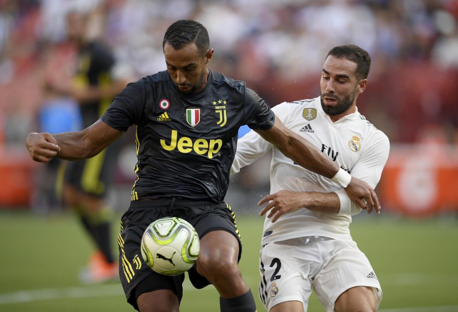 Juventus defender Medhi Benatia (left) battles for the ball against Real Madrid defender Daniel Carvajal (2) during the first half at an International Champions Cup tournament soccer match in Landover on Saturday.