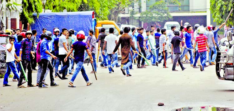 A group of youths equipped with sticks attacked the students demanding safe roads for the 8th consecutive day at Dhanmondi area on Sunday.