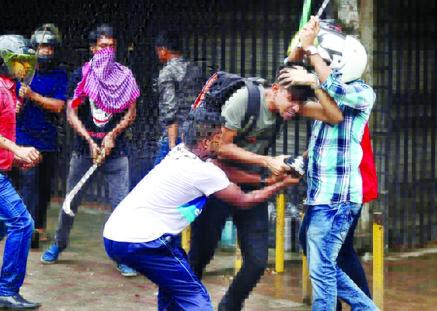 At least 7 photojournalists including a Reporter Ahmed Dipta (inset) were seriously injured as BCL activists swoop on them at Science Laboratory intersection in Dhaka on Sunday.