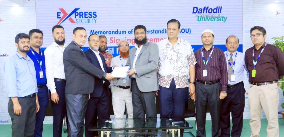 Prof Dr AKM Fazlul Hoque, Registrar (In-Charge) of Daffodil International University and Md. Khorshed Alam Khan, Proprietor, Express Security exchanging documents after signing a MoU on Sunday at the University campus. Hamidul Haque Khan, Treasurer, is al