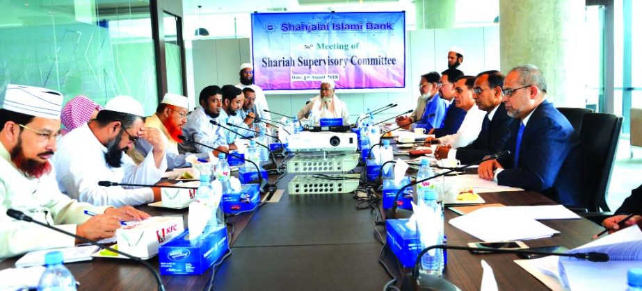 Mufti Abdul Halim Bukharee, Chairman of Shahjalal Islami Bank's Shariah Supervisory Committee, presiding over its 56th meeting at its head office in the city recently. Akkas Uddin Mollah, Chairman, Farman R Chowdhury, Managing Director, Md. Sanaullah Sha