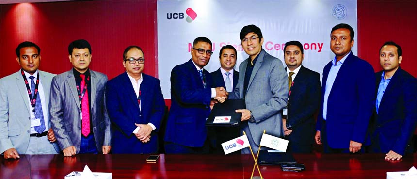 Taufiq Hassan, Head of Retail Business of United Commercial Bank Limited and Mostafa Noor -E- Safa, Head of Operations of Coffee Bean and Tea Leaf, exchanging a MoU signing document at the Bank's head office in the city recently. Under the MoU, all VISA