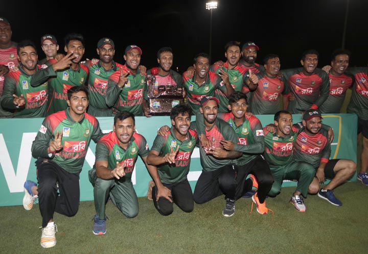 Players of the Bangladesh team pose with the trophy after Bangladesh defeated the West Indies in a Twenty20 international cricket match in Lauderhill, Fla on Monday. Bangladesh won by 19 runs to clinch the series.