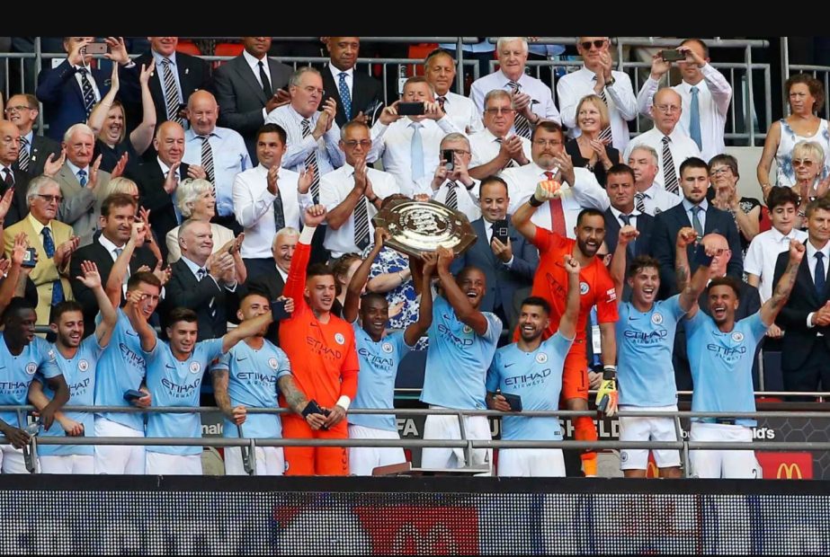 The Man City players hold the Community Shield after outclassing Chelsea at Wembley on Sunday.