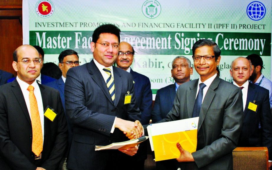 Ahmed Jamal, Deputy Governor of Bangladesh Bank and Hassan O. Rashid, AMD of Eastern Bank Limited (EBL), exchanging an agreement signing document under Investment Promotion and Financing Facility II (IPFF II) Project of BB at its head office on Tuesday. U