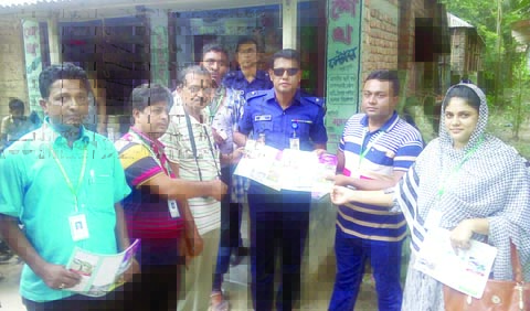 RANINAGAR ( Naogaon): Leaders of Nirapad Sarak Chai(NIACH), Raninagar Upazila Unit distributing awareness leaflet to OC Siddikur Rahman during a police drive on Sunday.