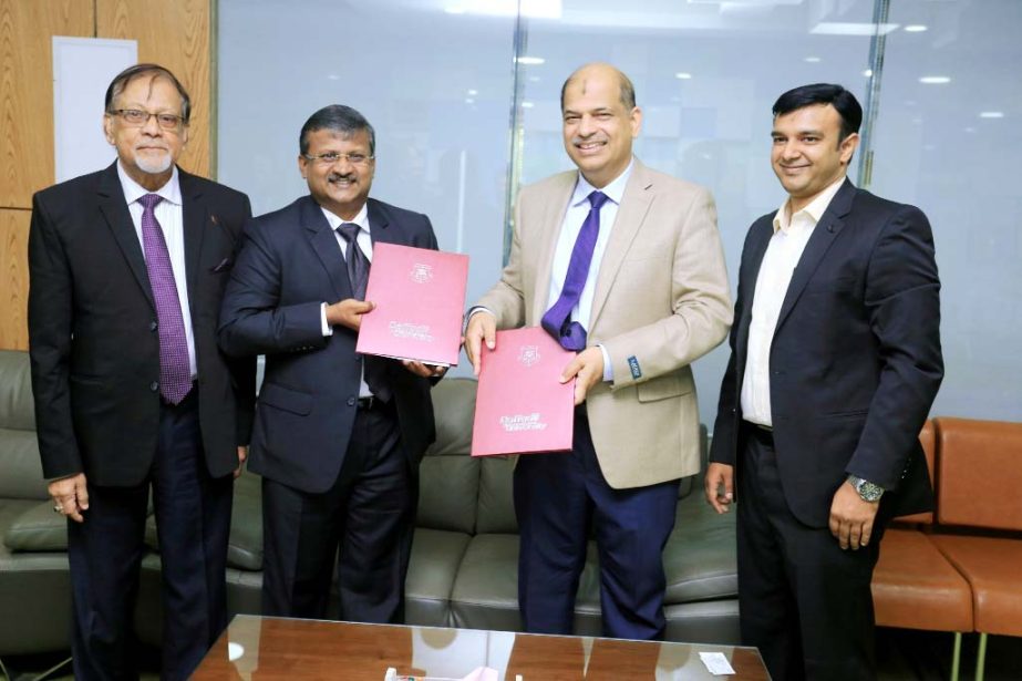 Pramod P, Thevannoor, Vice Chairman, SCMS Group of Educational Institutions and Prof Dr Yousuf M Islam, Vice Chancellor of Daffodil International University exchanging documents of a MoU signed by the parties at DIU campus recently. Prof Dr SM Mahabubul H