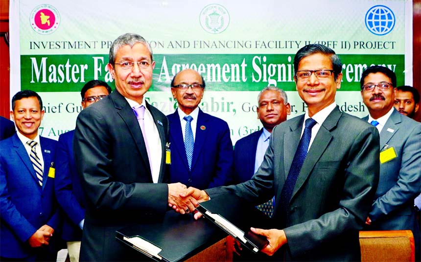 Ahmed Jamal, Deputy Governor of Bangladesh Bank and Project Director of IPFF II Project and Emranul Huq, Acting Managing Director of Dhaka Bank Limited sign master facility agreement of IPFF-II Project at a ceremony at the Central Bank on Tuesday. Fazle K