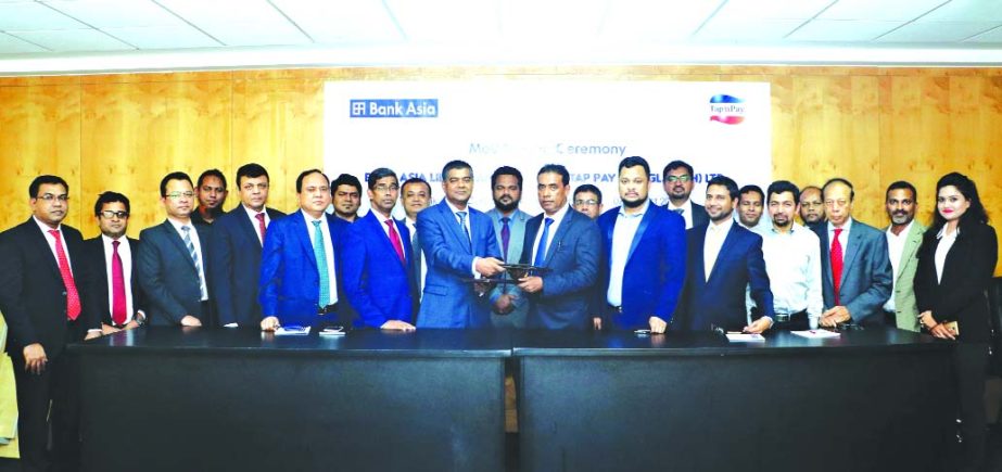 SM Iqbal Hossain, Head of Int'l Business and Export Finance of Bank Asia Limited and Dr. Md. Zahir Uddin, Chairman of Mobility i Tap Pay Limited, exchanging a MoU signing document at the Bank's head office on Tuesday. Md. Arfan Ali, Managing Director of