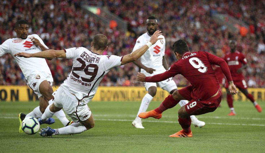 Liverpool's Roberto Firminho (right) scores his side's first goal of the game during the pre-season soccer match between Torino and Liverpool at Anfield, Liverpool, England on Tuesday.