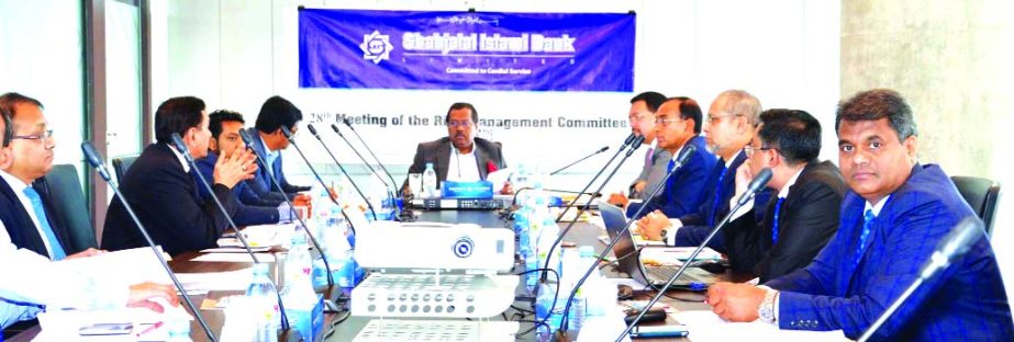 Mohammad Younus, Director and Risk Management Committee Chairman of Shahjalal Islami Bank Limited, presiding over its 28th meeting at its head office in the city recently. Farman R Chowdhury, Managing Director, Md. Moshiur Rahman Chamak and Khorshed Alam