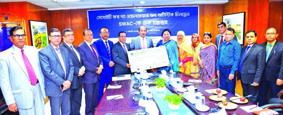 AKM Shaheed Reza, Chairman of Mercantile Bank Limited, handing over a cheque to Subarna Chakma, Chairperson of Society for the Welfare of Autistic Children (SWAC) at the Bank's head office in the city on Wednesday. Kazi Masihur Rahman, Managing Director,