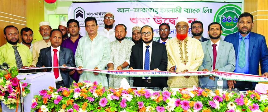 Abdul Malek Molla, Director of Al-Arafah Islami Bank Limited, inaugurating its 156th branch at Hatia in Noakhali on Thursday as chief guest. Md. Fazlul Karim, DMD, AKM Amzad Hossain, SVP of the bank and local elites were also present.