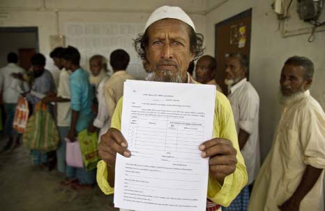 Kismat Ali, whose wife's name did not appear on the National Register of Citizens (NRC) draft, shows a form he collected to file an appeal in Mayong, 45 kilometers (28 miles) east of Guahati, India on Friday. On Friday, the 3.9 million residents left off