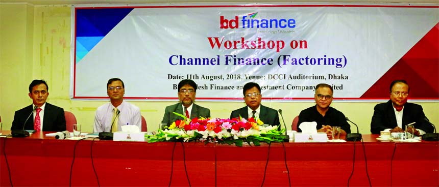 Manwar Hossain, Chairman of BD Finance Limited, presiding over its day-long workshop on Channel Finance (Factoring) at an auditorium in the city on Saturday. Tarik Morshed, Managing Director of the company, Professor Dr. Prashanta Kumar Banarjee, Director