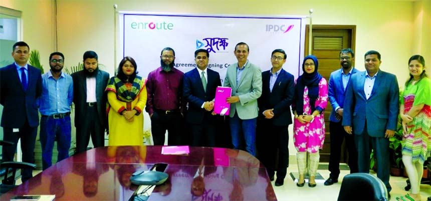 Mominul Islam, Managing Director and CEO of IPDC Finance Limited and Abu Daud Khan, CEO of Enroute International Limited, exchanging an agreement signing document for specialized e-learning course on "Anti-Money Laundering and Combating Financing of Terr