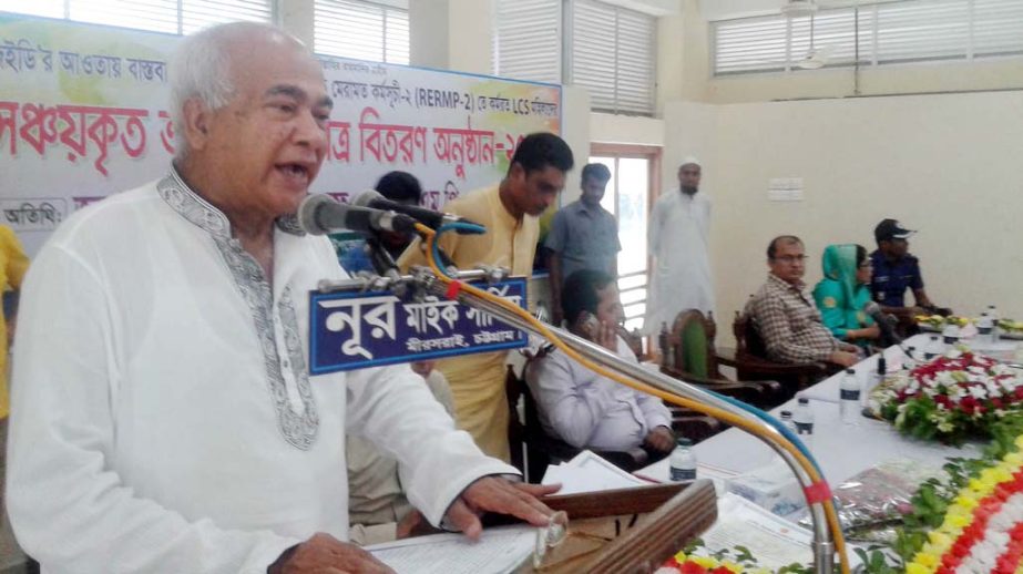 Housing and Public Works Minister Engineer Mosharraf Hossain speaking at the cheques and saving certificates distributing ceremony of Rural Employment and Road Repairing Programme-2 under LGED at Mirersarai Upazila Parishad Auditorium as Chief Guest yes