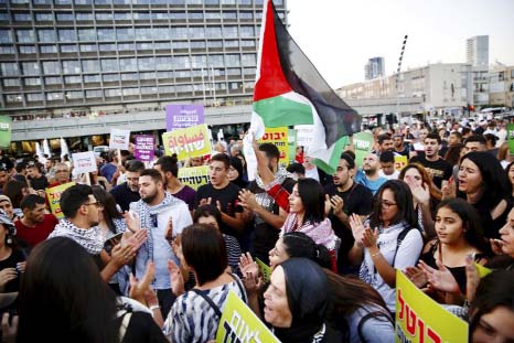 Israeli Arabs and their supporters take part in a rally to protest against Jewish nation-state law in Rabin square in Tel Aviv, Israel on Saturday.