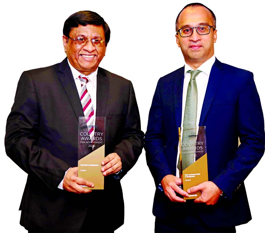 City Bank Managing Director Sohail R. K. Hussain and Additional Managing Director Mashrur Arefin pose with Finance Asia's "Best Bank"" and ""Best Investment Bank"" award winning trophies in Hong Kong recently."