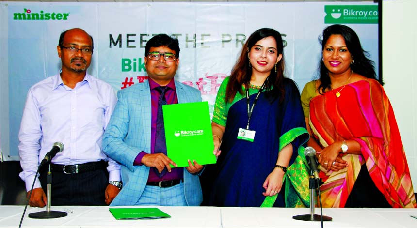 Eshita Sharmin, head of marketing and sales of Bikroy.com and KMG Kibria, head of brands of Minister Hi-Tech Park Limited, exchanging an agreement signing document for campaign on the occasion of next Eid-ul-Azha at an auditorium in the city on Sunday. Se