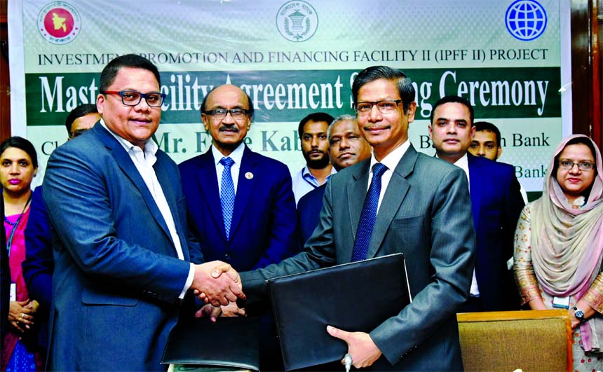 Ahmed Jamal, Project Director of Investment Promotion and Financing Facility II (IPFF) project with Bangladesh Bank (BB) and Rahel Ahmed, Managing Director of Prime Bank Limited, exchanging an agreement signing document at BBs head office recently. Under