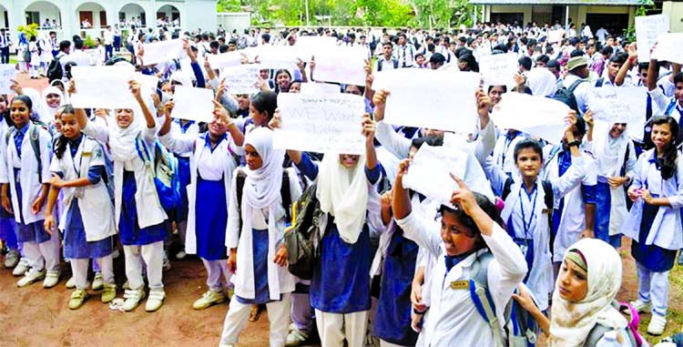 Agitating students blocked the road in front of Collectorate School and College in Rangpur city protesting killing of their fellow student and demanding punishment to those responsible owner, driver and helper of killer bus. This photo was taken on Monday