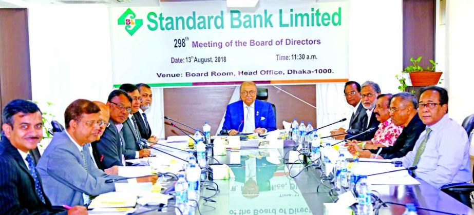 Kazi Akram Uddin Ahmed, Chairman, Board of Directors of Standard Bank Limited, presiding over its 298th meeting at its head office in the city on Monday. Mohammed Abdul Aziz, Vice-Chairman, Mamun-Ur-Rashid, Managing Director, Kamal Mostafa Chowdhury, Fero