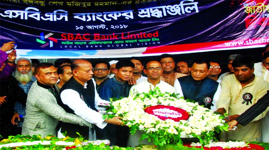 South Bangla Agriculture and Commerce (SBAC) Bank Ltd Managing Director Md Golam Faruque, EC Committee Chairman M Moazzem Hossain, Additional Managing Director Mostafa Jalal Uddin Ahmed and senior officials placing floral wreaths at the portrait of Bangab