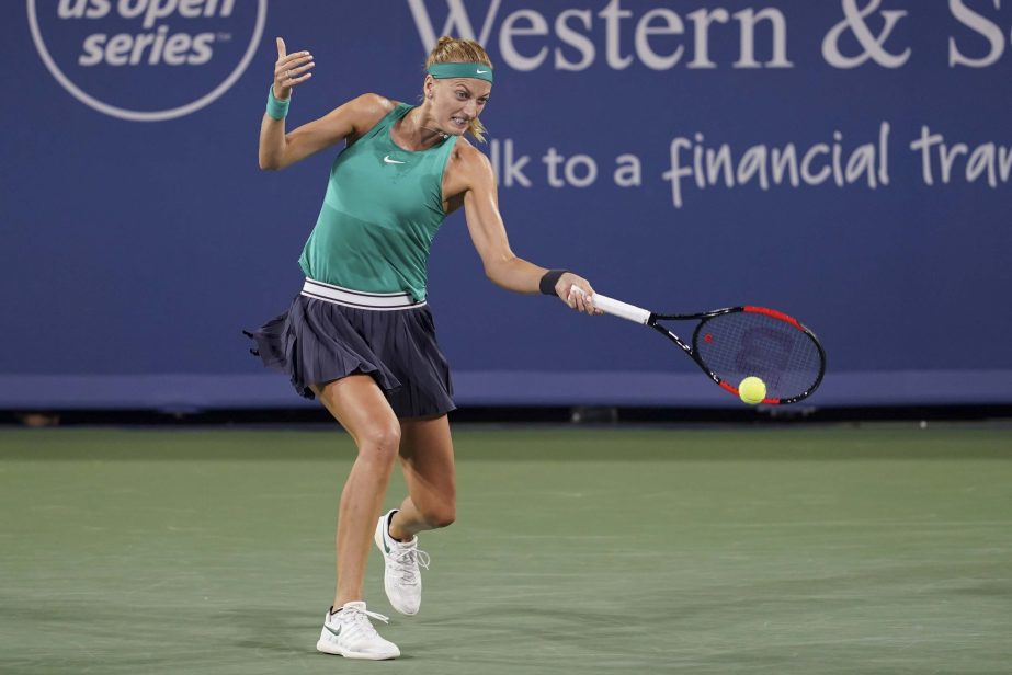 Petra Kvitova of the Czech Republic, serves to Serena Williams at the Western & Southern Open tennis tournament in Mason, Ohio on Tuesday.