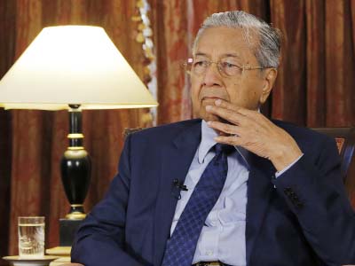 Malaysia Prime Minister Mahathir Mohamad listens during an interview with The Associated Press in Putrajaya, Malaysia on Monday.