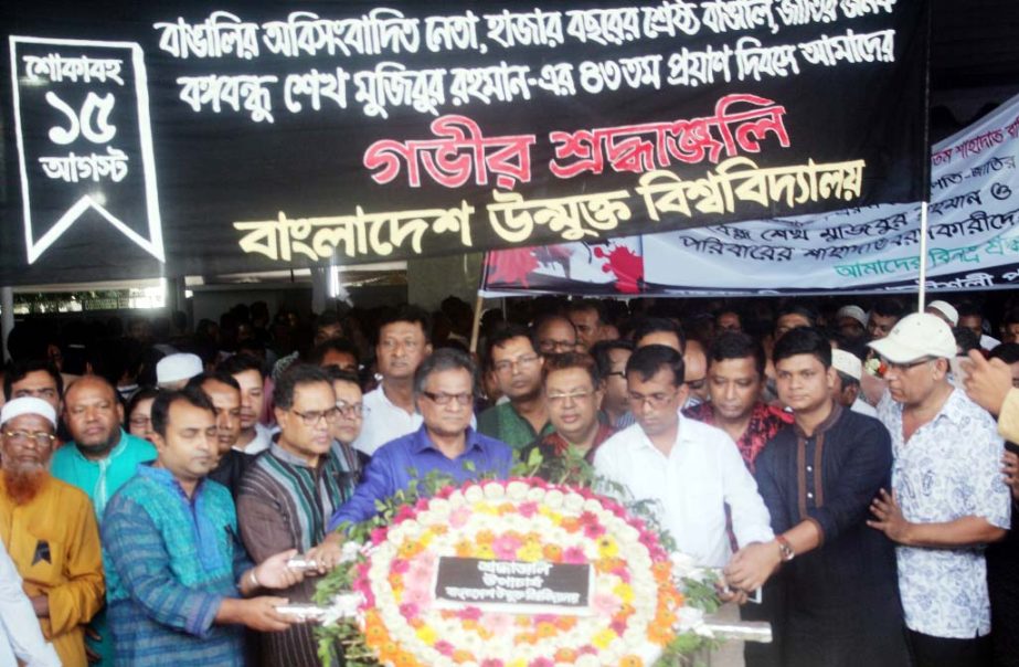 Vice Chancellor of Bangladesh Open University Prof Dr MA Mannan placing wreaths at the mural of Bangabandhu Sheikh Mujibur Rahman at 32 Dhanmondi in the capital observing the 43rd National Mourning Day on Wednesday.