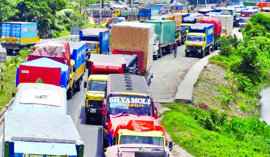 Passengers continue to suffer as huge vehicles got stuck in a 35-Km tailback on Dhaka-Chattogram Highway on Thursday as 4-lane construction work was going on for long. The photo was taken from Daudkandi area on Thursday.