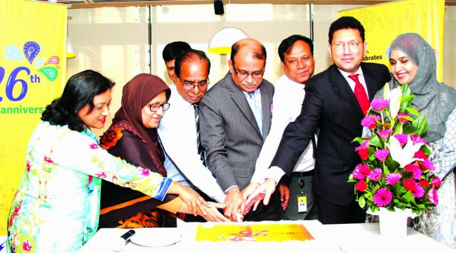 Managing Director of Eastern Bank Limited Ali Reza Iftekhar, inaugurating its 26th anniversary programme by cutting a cake at its corporate head office in the city on Thursday. Additional Managing Director Hassan O. Rashid and other senior officials of th