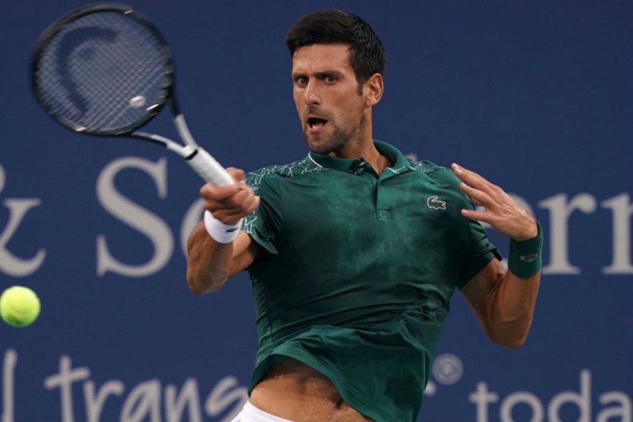 Novak Djokovic of Serbia returns a shot against Grigor Dimitrov of Bulgaria in the Western and Southern tennis open at Lindner Family Tennis Center in Cincinnati on Thursday.