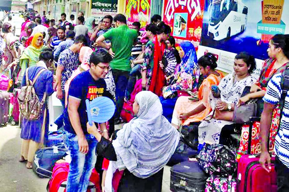 Due to severe traffic jam in highways, home-bound people are anxiously waiting for buses to go to their respective destinations to share Eid-ul-Azha festival with their relatives. This picture was taken from city's Gabtali Bus Terminal on Friday.