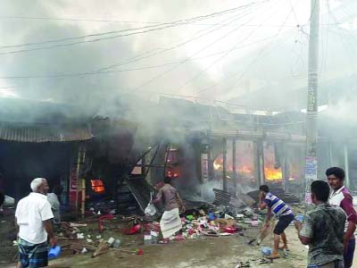 DINAJPUR: A devastating fire gutted 12 shops at Sharif Market in Kansama Upazila on Thursday.