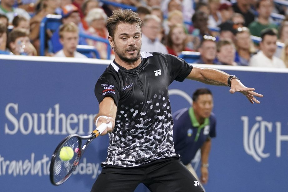 Stan Wawrinka of Switzerland, returns to Roger Federer, also of Switzerland, in a quarterfinal match at the Western & Southern Open tennis tournament on Friday in Mason, Ohio.