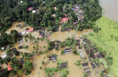 An aerial view shows partially submerged houses at a flooded area in the southern state of Kerala.