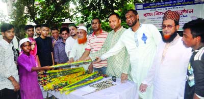 SYLHET: Rawsanuzzaman Siddiki, Additional Deputy Police Commission (Protection and Protocol), Sylhet distributing umbrellas among the poor, orphan students jointly organised by Wayakar and Ramaniya Protibondhi Kalyan Foundation as Chief Guest recently