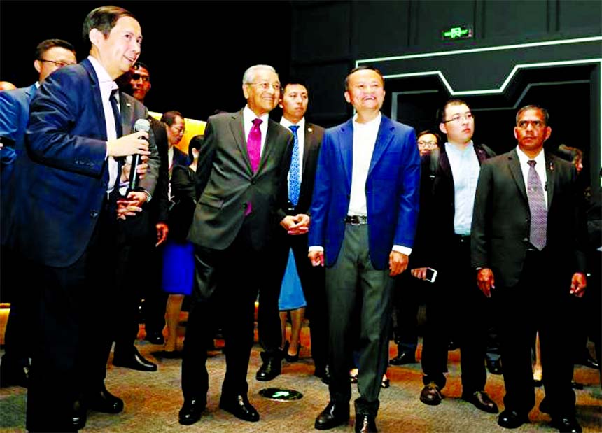 Malaysia`s Prime Minister Dr. Mahathir Mohamad visited the Alibaba Corporate headquarters with Alibaba chairman Jack Ma (centre right) in Hangzhou, in China`s eastern Zhejiang province on 18 August 2018. Mahathir is on a five-day state visit to China.