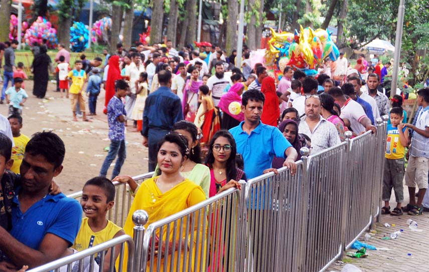 Visitors waiting in long queue for entering the recreation center. The snap was taken from in front of the Shishu Park on Friday.
