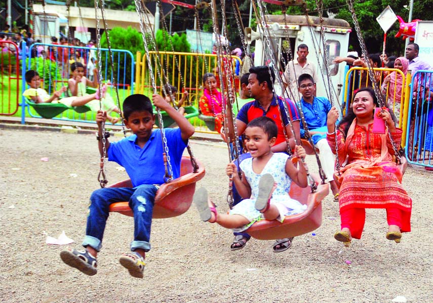 Children getting amusement at a recreation center on the fourth day of Eid-ul-Azha holiday. The snap was taken from the city's Shishu Park on Friday.
