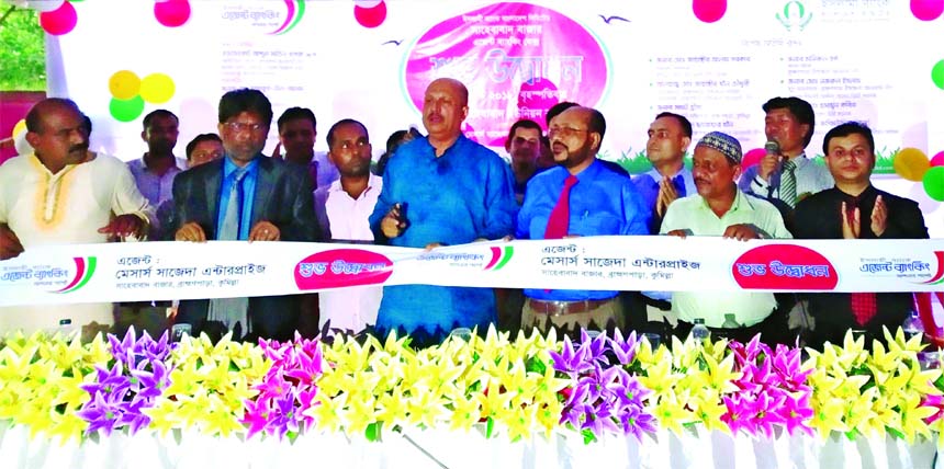 Parliament Member Advocate Abdul Matin Khasru inaugurating an agent banking outlet of Islami Bank Bangladesh at Sahebabad in Cumilla on Thursday. Taher Ahmed Chowdhury, DMD, Md. Mosharraf Hossain, Cumilla Zonal Head, Md. Moniruzzaman Sarkar, AVP of the Ba