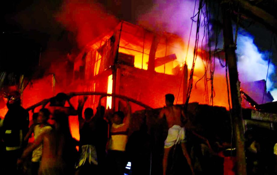 Fire fighters trying to douse the flame as fire breaks out at a plastic factory in Islambagh in Old Dhaka on Friday.