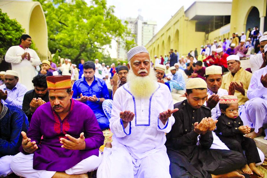 Devotees offer Munajat at the Baitul Mukarram National Mosque after the Eid-ul-Azha prayers on Wednesday.
