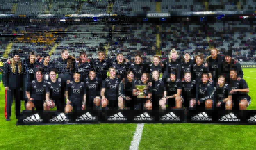 New Zealand's players with the Laurie O'Reilly Trophy after defeating Australia in the women's rugby test match at Eden Park in Auckland, New Zealand on Saturday.