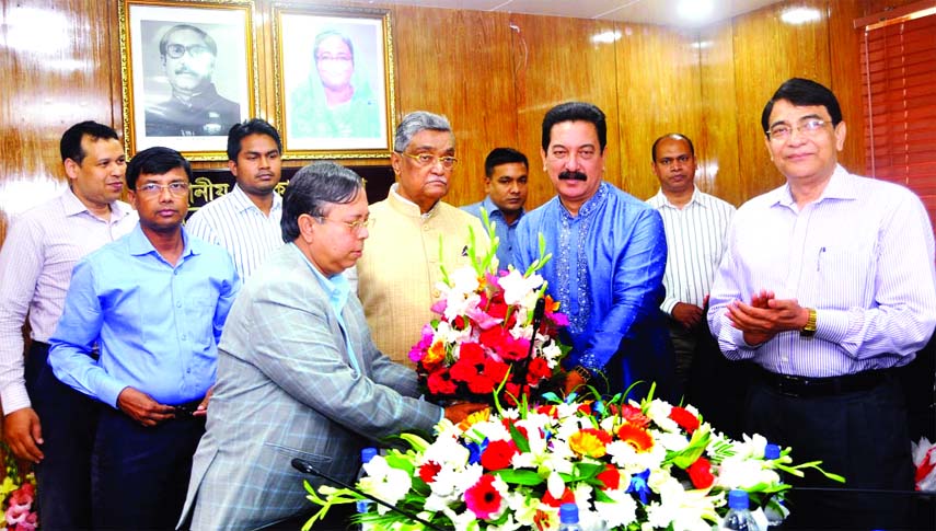 LGRD and Cooperatives Minister Engr Khondkar Mosharraf Hossain MP and State Minister for Local Govt and Rural Development Mashiur Rahman Ranga exchanging Eid greetings with the officers and employees of the Ministry yesterday .