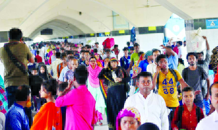 Holidaymakers continue to start returning to Dhaka after Eid vacation as Kamalapur Station platform being overcrowded on Sunday.