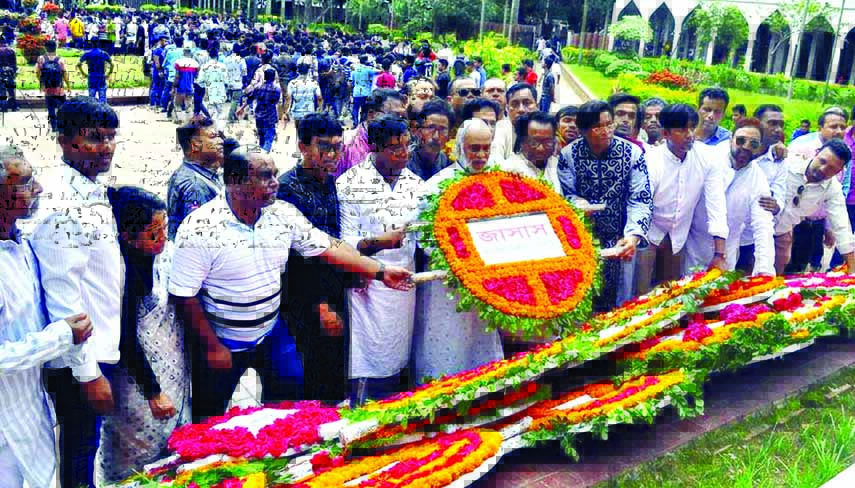 Leaders and activists of BNP and JASAS led by BNP Standing Committee Member Dr Moin Khan placing floral wreaths at the Mazar of National Poet Kazi Nazrul Islam marking the 42nd death anniversary of the poet.